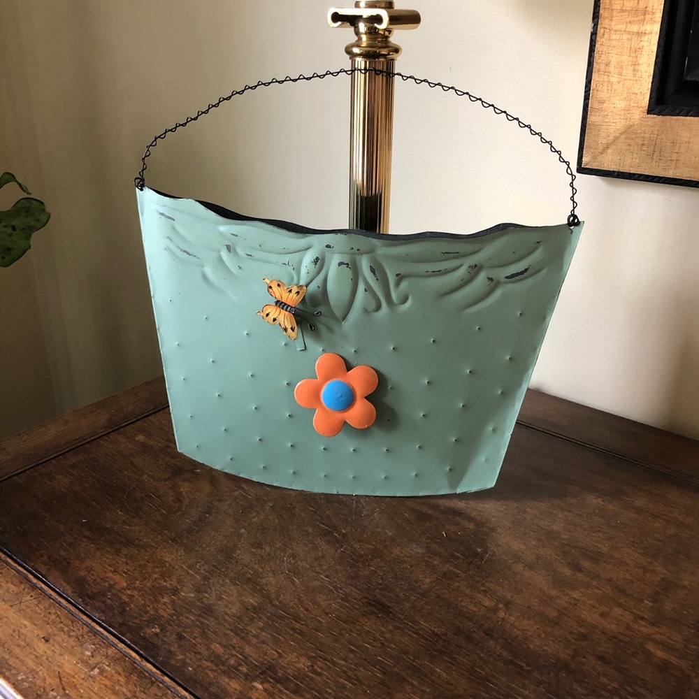 Adorable green metal wall pocket.
